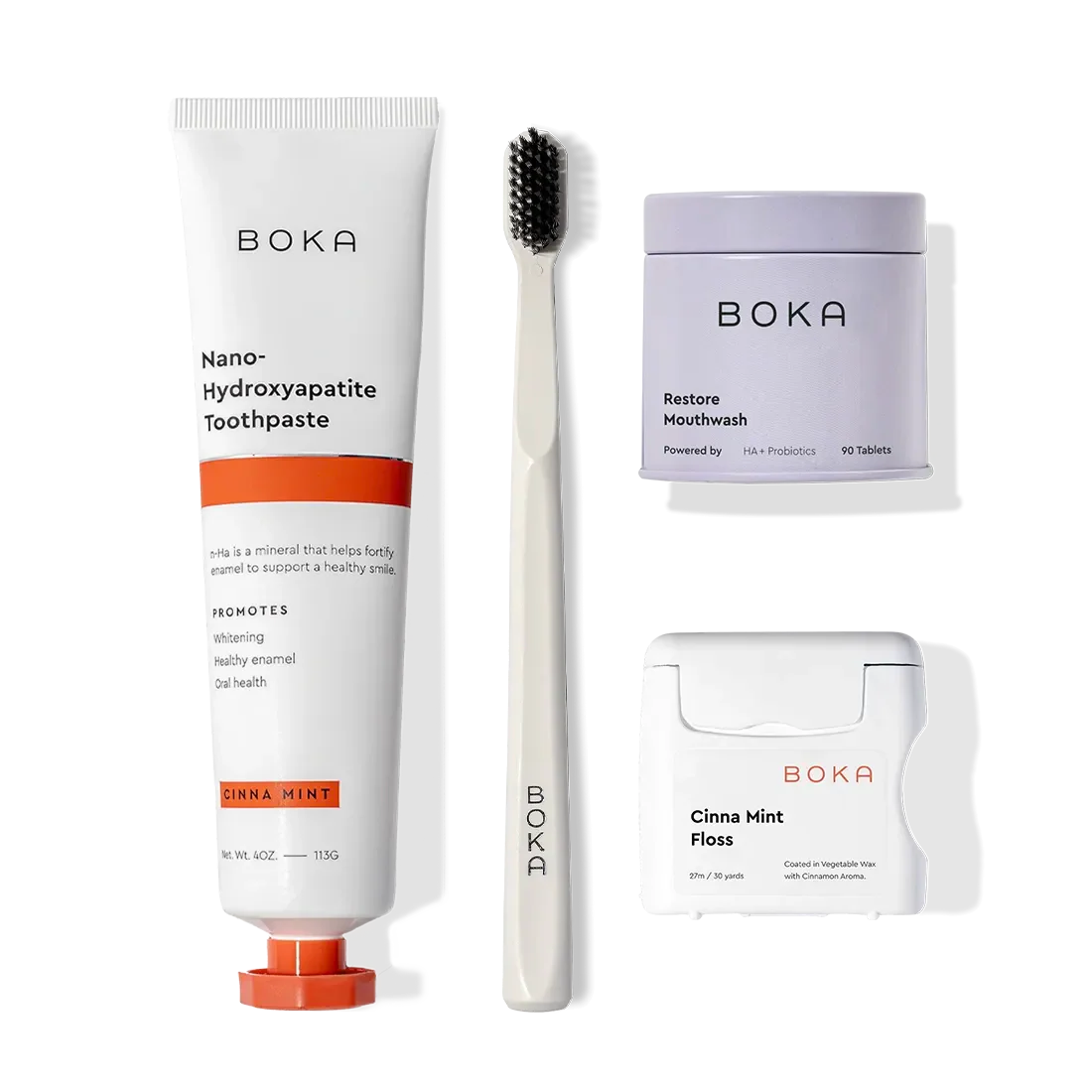 Advanced Kit: Boka toothpaste (safe if swallowed), toothbrush, tabs & floss on a white background.