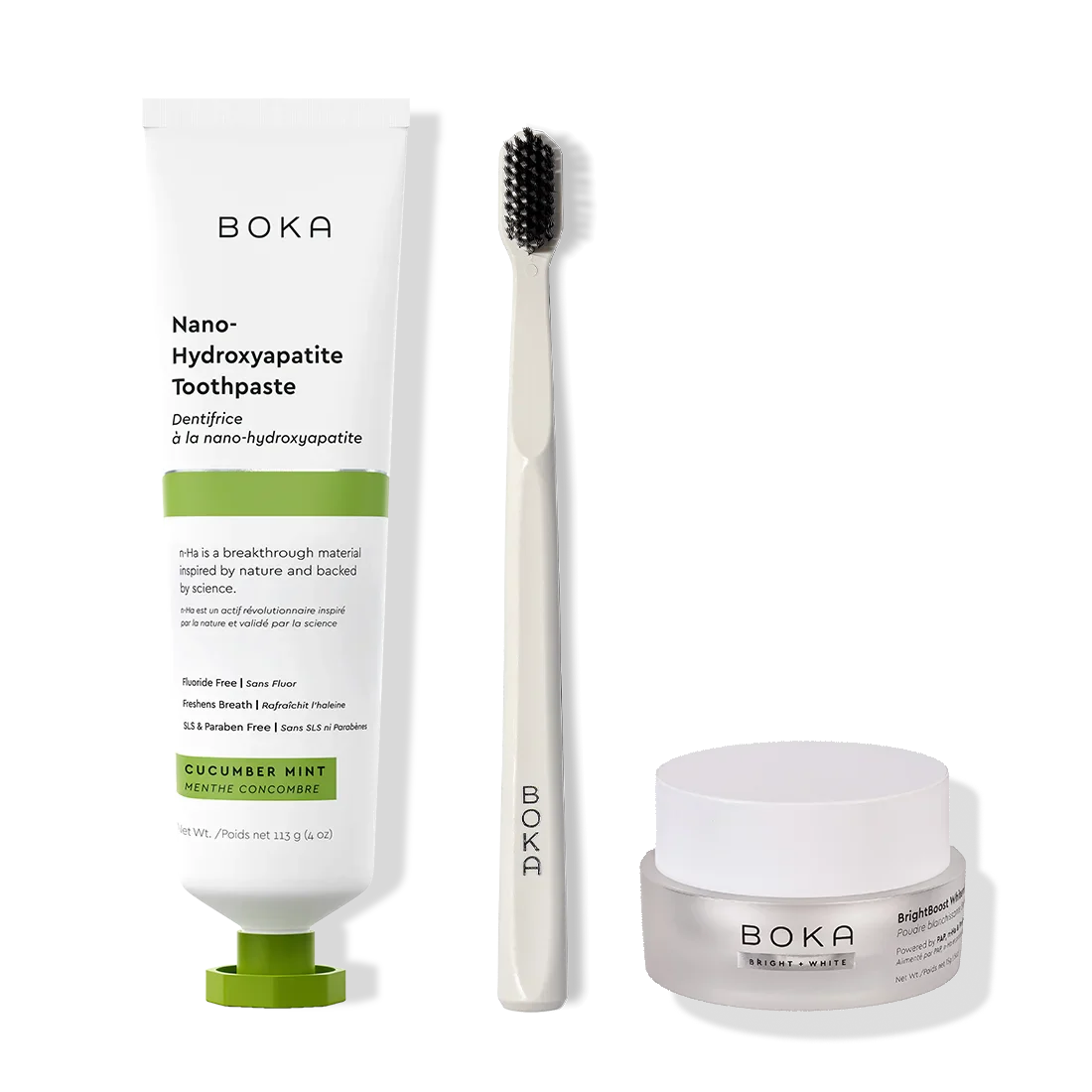 Boka toothpaste, toothbrush, and whitening powder on a white background
