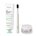 Boka toothpaste, toothbrush, and whitening powder on a white background