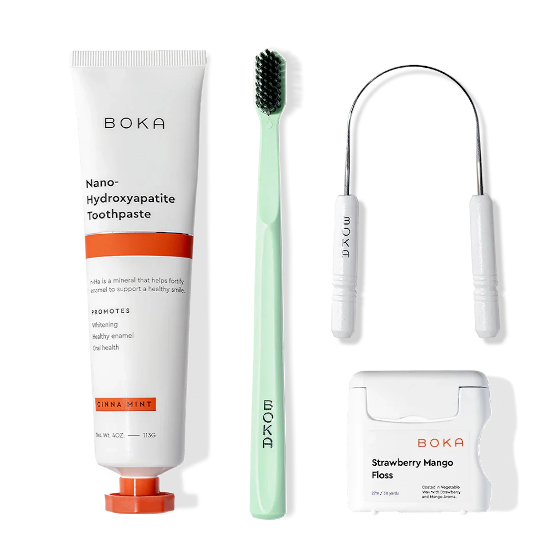 Boka Starter Kit with toothpaste, toothbrush, floss, and tongue scraper on a white background.