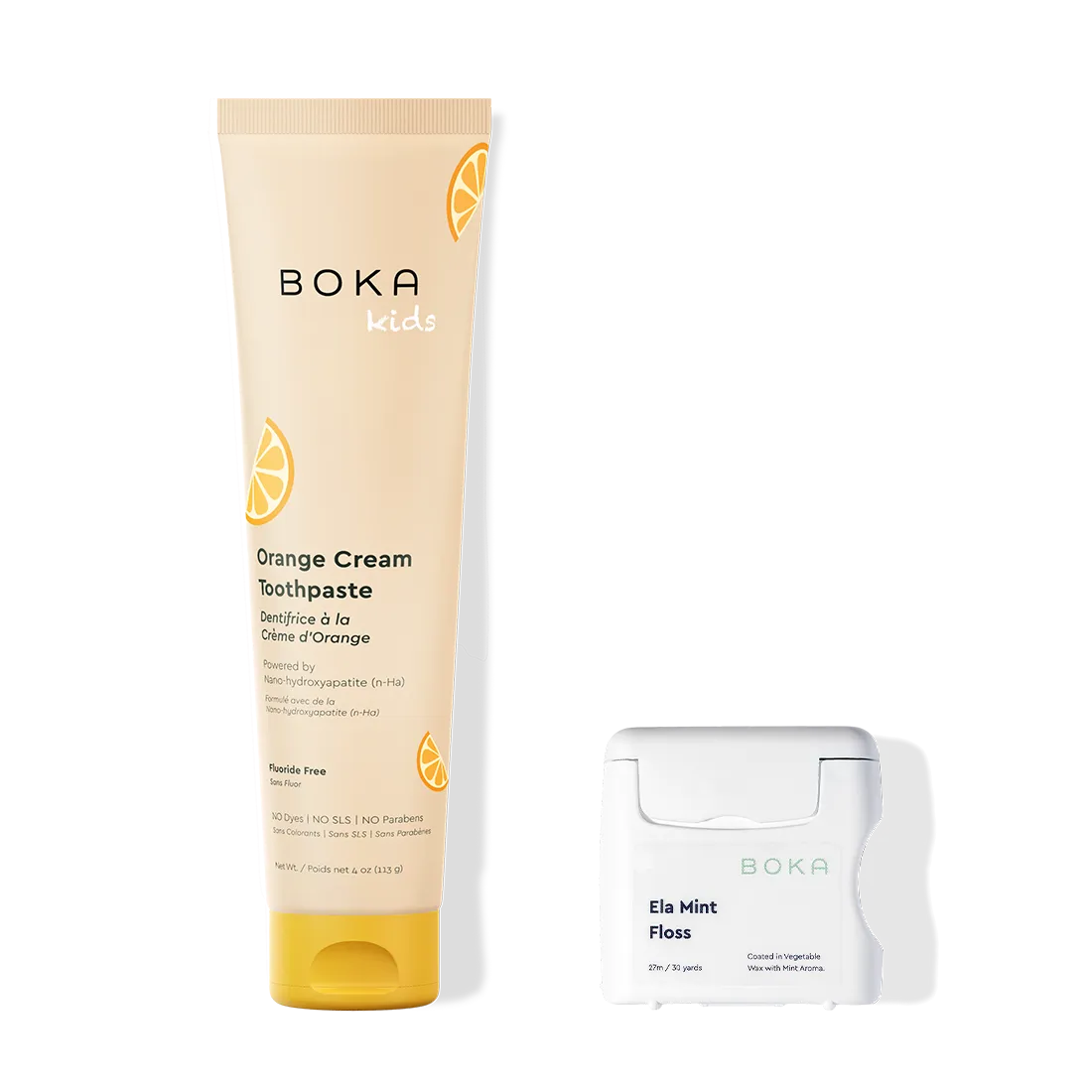 Boka Kids Orange Cream Toothpaste and Ela Mint Floss on a white background