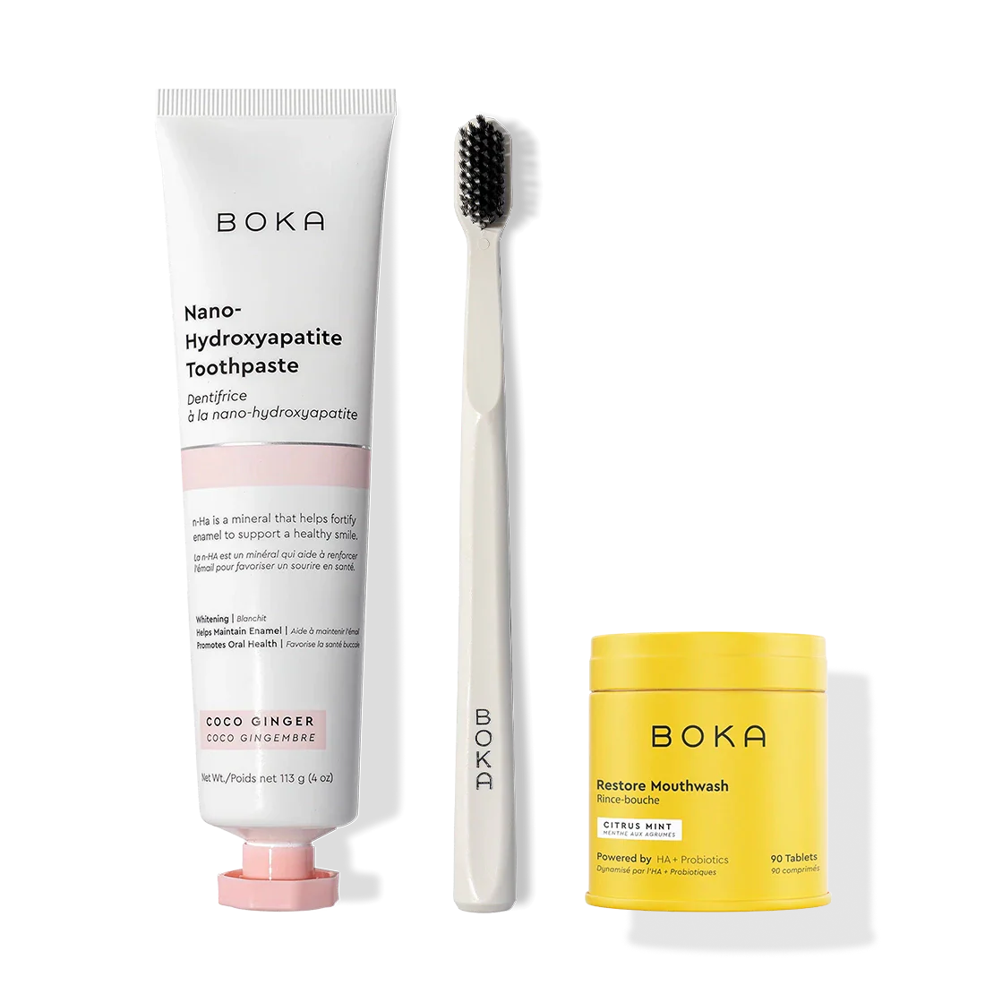 Fresh Faced toothpaste, black charcoal-bristle toothbrush, and yellow mouthwash tablets container.