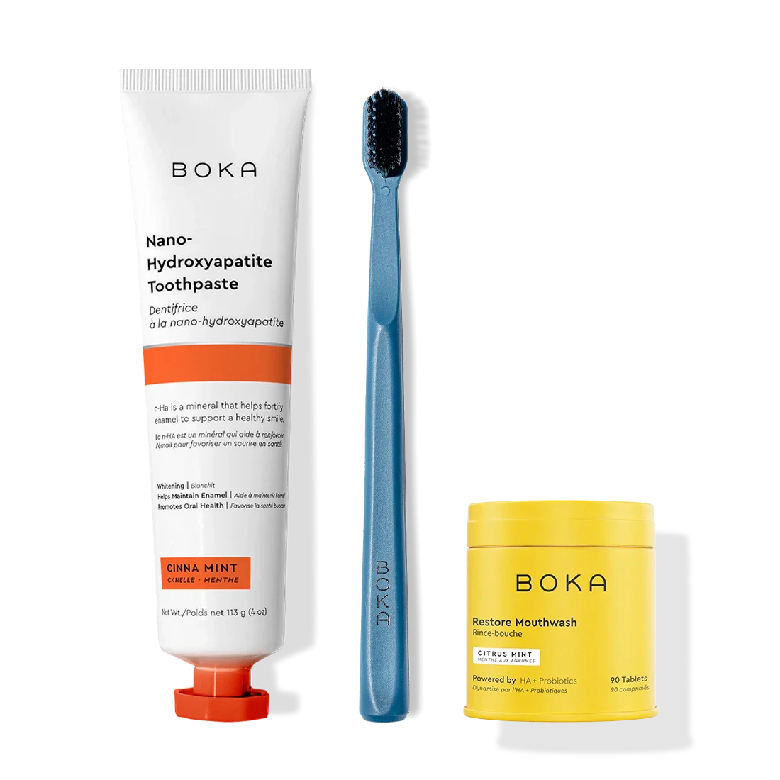 Fresh Faced toothpaste, blue toothbrush with charcoal bristles, and Restore Mouthwash tablets.