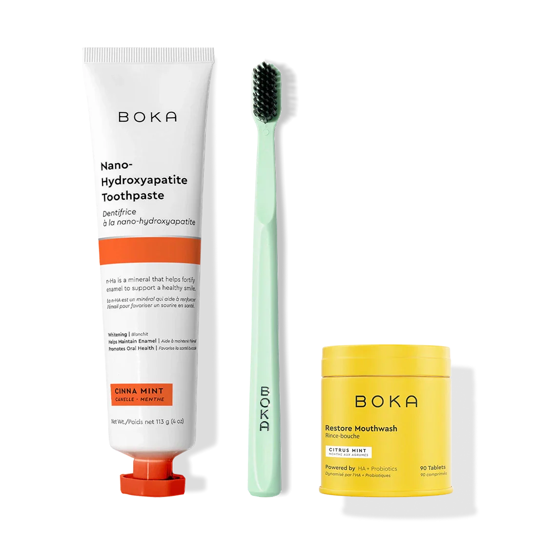 Fresh Faced: toothpaste, green brush with charcoal bristles, and yellow Restore Mouthwash tablets.