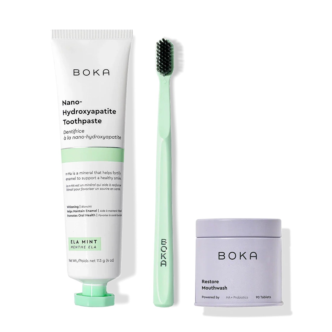 Fresh Faced toothpaste, green brush with charcoal bristles, and Restore mouthwash tablets.