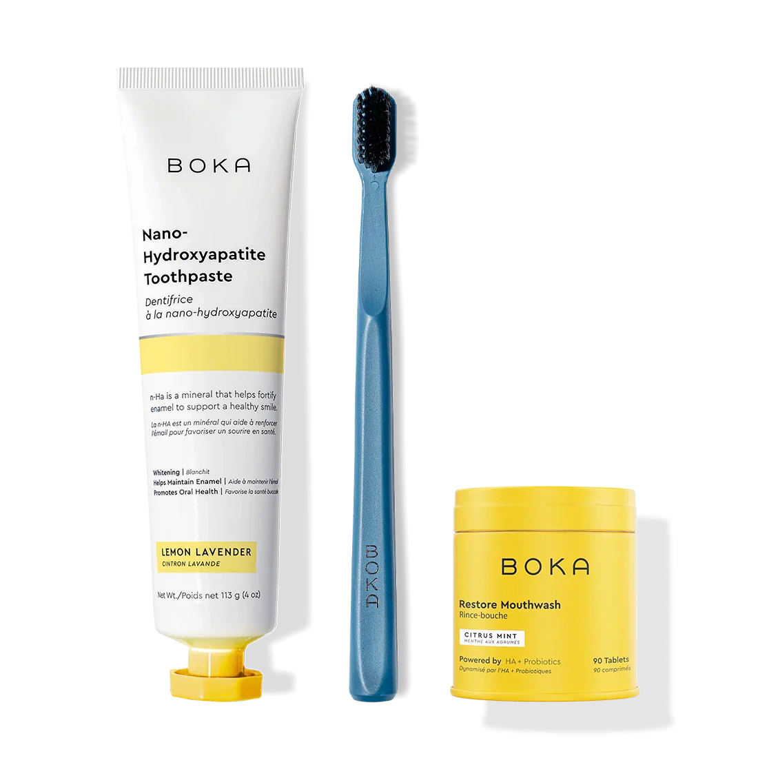 Fresh Faced Toothpaste, blue toothbrush with charcoal bristles, and Restore Mouthwash tablets.
