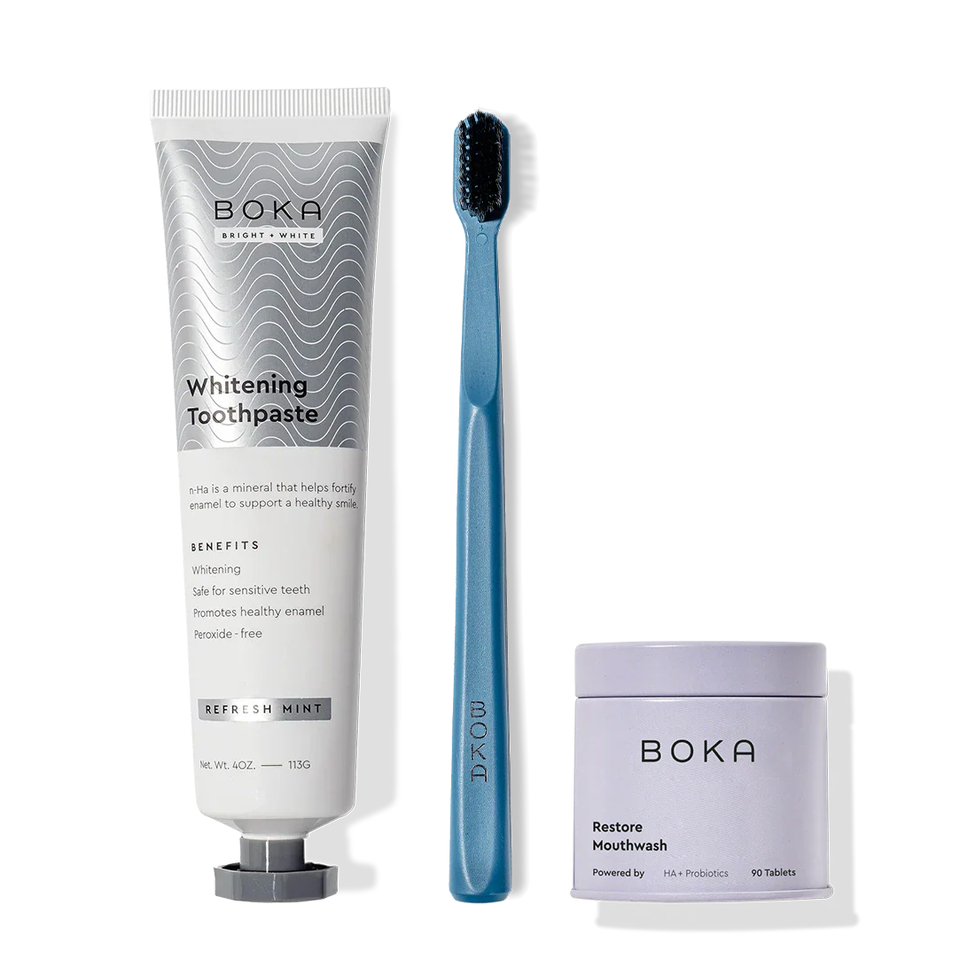 Fresh Faced: Toothpaste tube, blue toothbrush with charcoal bristles, and Restore Mouthwash.