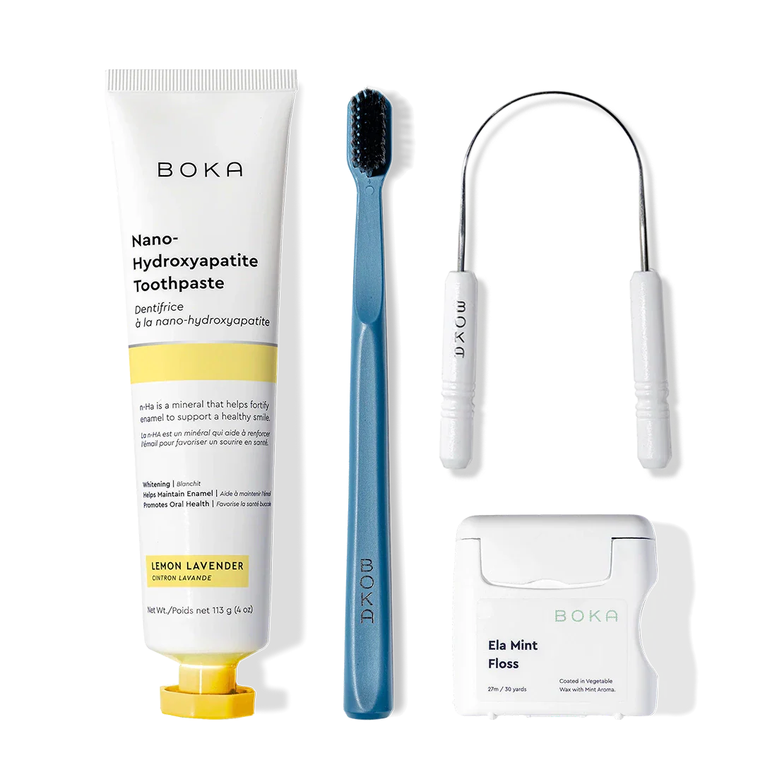 Starter Kit: toothpaste, blue brush with charcoal bristles, floss & tongue cleaner on white.