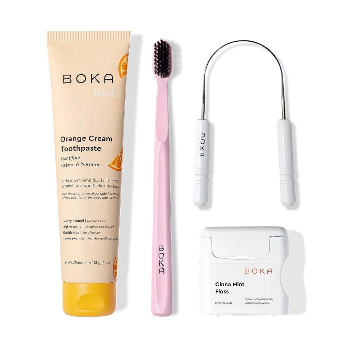 Boka Starter Kit: kids n-Ha Toothpaste, pink brush with charcoal bristles, and tongue cleaner shown.