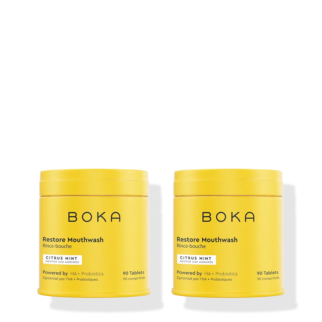 Two yellow containers of Boka Restore Mouthwash on a white background